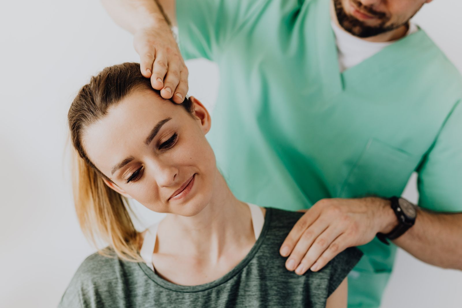 Chiropractor treating a patient after a car accident